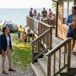 Woman arriving to discover her in-laws took over her beach house while her brother-in-law blocks her from entering.