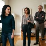 Parents demanding money for sister confront Nicole inside her home as her frightened young daughter watches from the doorway.