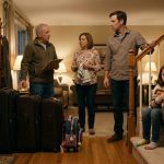 Eight-year-old Mia holding her packed travel bag after being asked to give up her spot on the family vacation