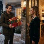 Kyle holding Christmas gifts outside his sister's house after he drove four hours for Christmas.