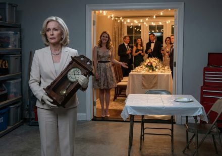 Mother seated in the garage while relatives celebrate her daughter's anniversary inside the dining room