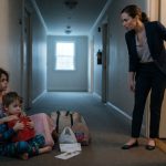 A woman discovers her sister's two children sitting outside her apartment with bags, a red lunchbox, and a mysterious brass key.