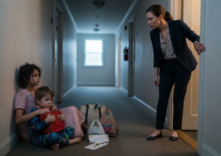 A woman discovers her sister's two children sitting outside her apartment with bags, a red lunchbox, and a mysterious brass key.