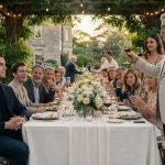 A 28-year-old man in a navy blazer arriving alone at an elegant family reunion at a country estate.