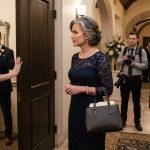 Mother standing outside the family room at her son's wedding while the bride blocks the doorway after she paid for my son's wedding.