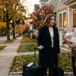 Woman came back from a business trip and looks confused as her neighbor approaches her holding a baby