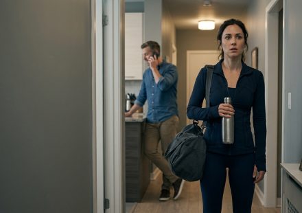 Woman standing silently in the hallway after overhearing her boyfriend say she wasn’t wife material