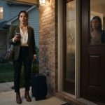 Woman standing outside her parents' home after they refuse to let her inside following her husband's affair.