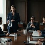 A composed woman holding a water pitcher watches her brother confidently prepare for an important partnership signing in an executive boardroom.