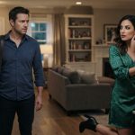 Concerned husband watches as his wife gets dressed for another girls' night while holding her phone inside their home.