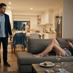 Uncomfortable husband watches his wife's best friend occupying the living room after temporarily moving into their home.
