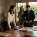 Claire confronts her sister and ex-husband at the farmhouse dining table as they reveal plans to turn the family apple orchard into a wedding resort.