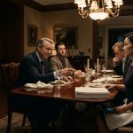 A female systems engineer confronts her powerful uncle across an elegant dining table as he presents a non-compete agreement and her worried parents watch.