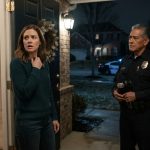 Molly opens her front door to two police officers after her husband and son fail to return from their fishing trip.