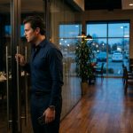 A disappointed man stands alone inside a restaurant after discovering that the family reunion he paid for took place without him, leaving the private dining room empty.