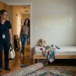 An exhausted nurse standing inside her dismantled child's bedroom after discovering her 7-year-old daughter was missing.