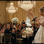 Rachel wearing a simple navy-blue evening dress at her sister's luxurious wedding reception while her family celebrates nearby.