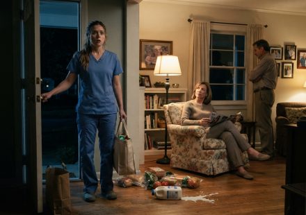 Olivia arriving home with groceries and finding her parents unexpectedly sitting inside her first house late at night.