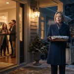 Older mother carrying homemade baked ziti outside her daughter's lavish housewarming party on a cold winter evening.