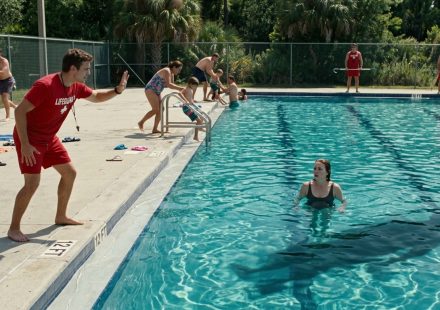Lifeguard Told Me Not to Move as I floated alone in a deep swimming pool while other swimmers evacuated and a mysterious shadow moved underwater.