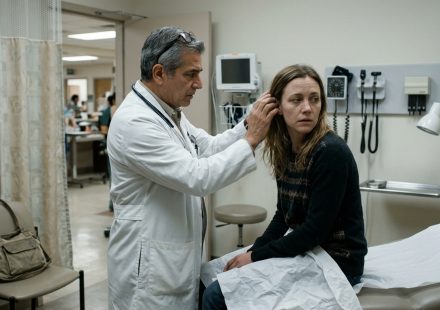 Cheyenne sits frightened in a hospital examination room after she'd had a headache for seven days, while a doctor examines a mysterious lump behind her ear.