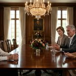 A 32-year-old businesswoman in a white shirt sitting calmly at a luxurious family dining table while her wealthy father and sister criticize her career.