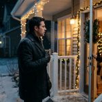 Jacob stands shocked outside his family's Christmas-decorated house as his mother refuses to let him inside on a freezing winter night.