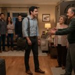 Grandfather questioning his grandson after he unexpectedly arrives by bus for the family Christmas gathering.
