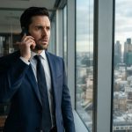 A successful real-estate investor standing in his high-rise office while receiving a disturbing phone call about ownership of his properties.