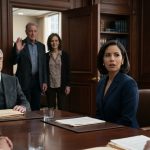 Woman in a navy suit facing her estranged parents and longtime family lawyer during a tense will reading